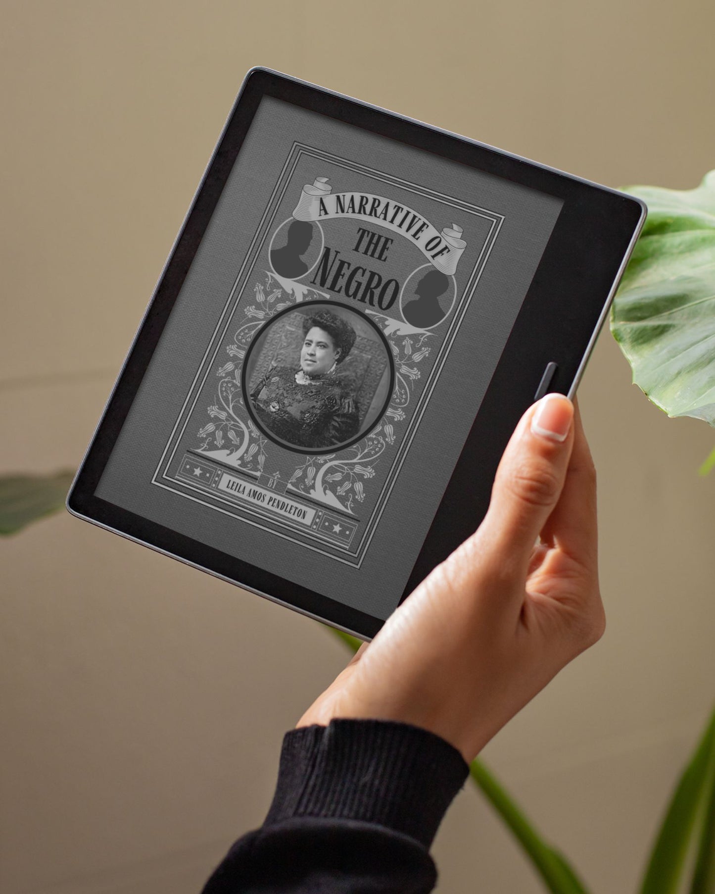 A greyscale image of the ebook A Narrative of the Negro held by a white woman's hand in front of a green plant.