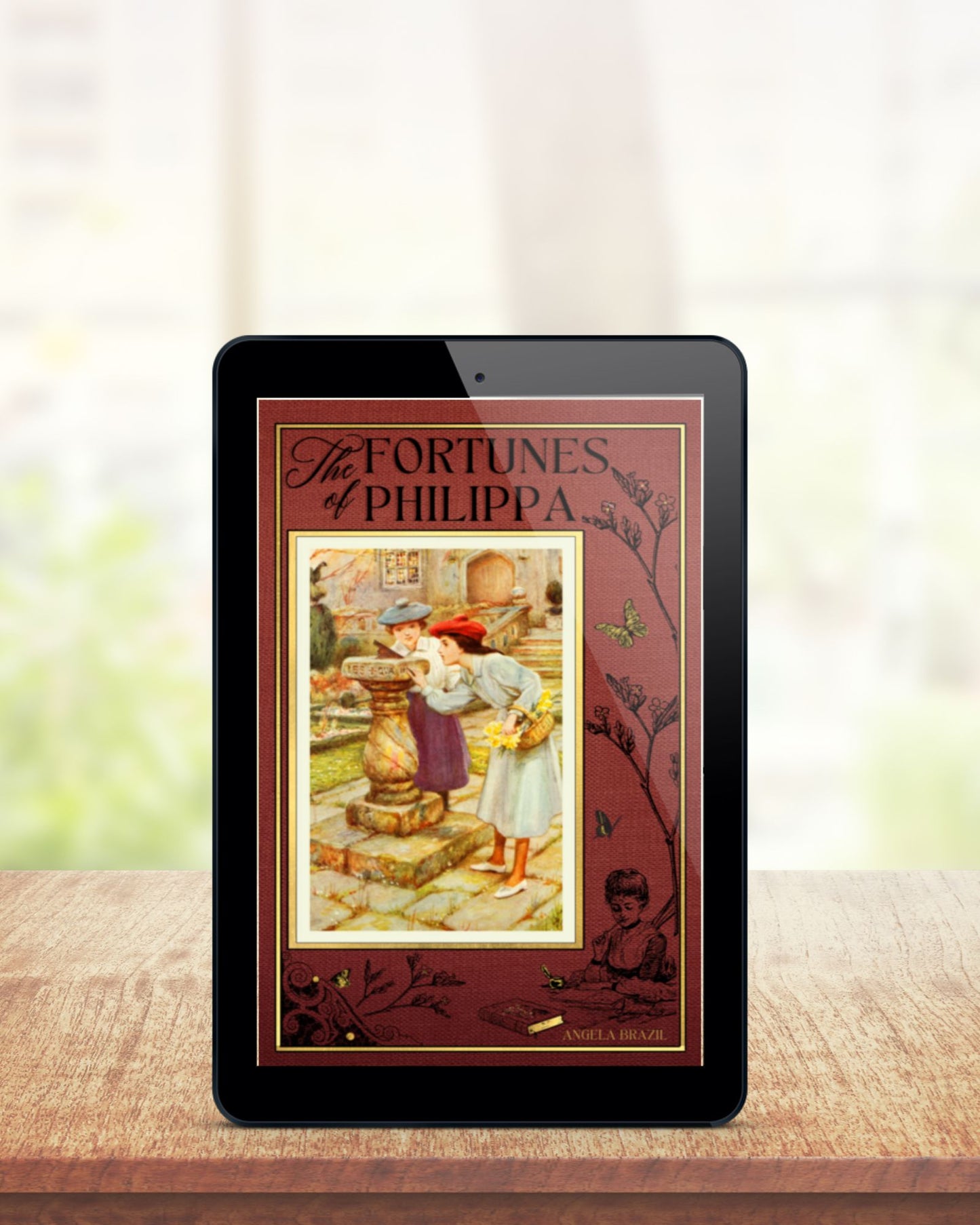 Black tablet stands upright on brown table before blurred pale background. The ebook displayed on the screen is the russet colored cover of "The Fortunes of Philippa".